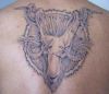 aries pic tattoo on back