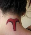 aries sign tattoo on back of neck