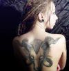 aries tattoo on girl's back