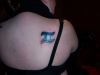 gemini pic tattoo on right shoulder
