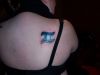 gemini pic tattoo on right shoulder