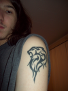 leo tattoo pic on left arm