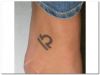 libra sign tattoo on feet