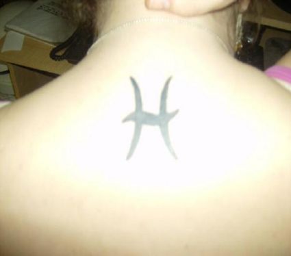 Pisces Sign Pic Tattoo On Back