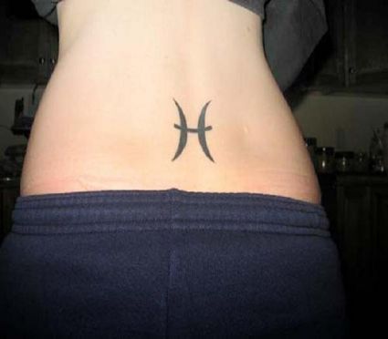 Pisces Sign Pic Tattoo On Lower Back Of Girl