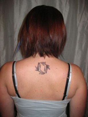 Pisces Tattoo On Girl's Back