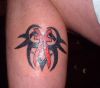 pisces pic tattoo on calf