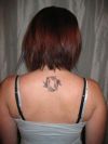 pisces tattoo on girl's back