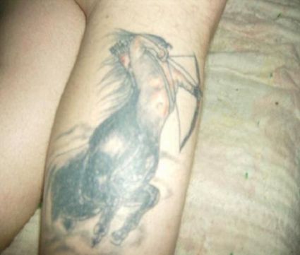 Sagittarius Pic Tattoo On Leg