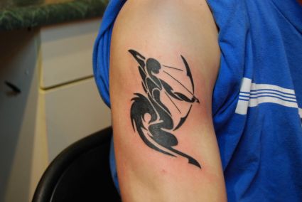 Tribal Sagittarius Tattoos On Arm