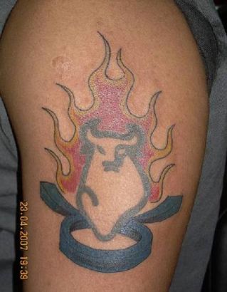 Burning Taurus Tattoo On Arm