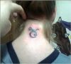 taurus sign tattoo on back of neck