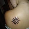 tribal sun and virgo sign tattoo