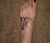 virgo sign pic tattoo on feet