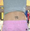 virgo sign tattoo on lower back
